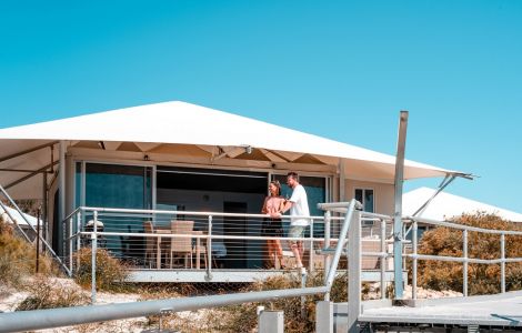 35106_discovery-parks-rottnest-island-deluxe-oceanside-tent-exterior-couple